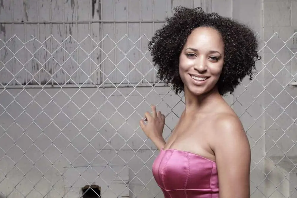 Hard Water Hair Treatment: How to Prevent and Treat Damage 3 A light-skinned black girl after using a vinegar rinse and citrus juice to remove mineral build-up.
