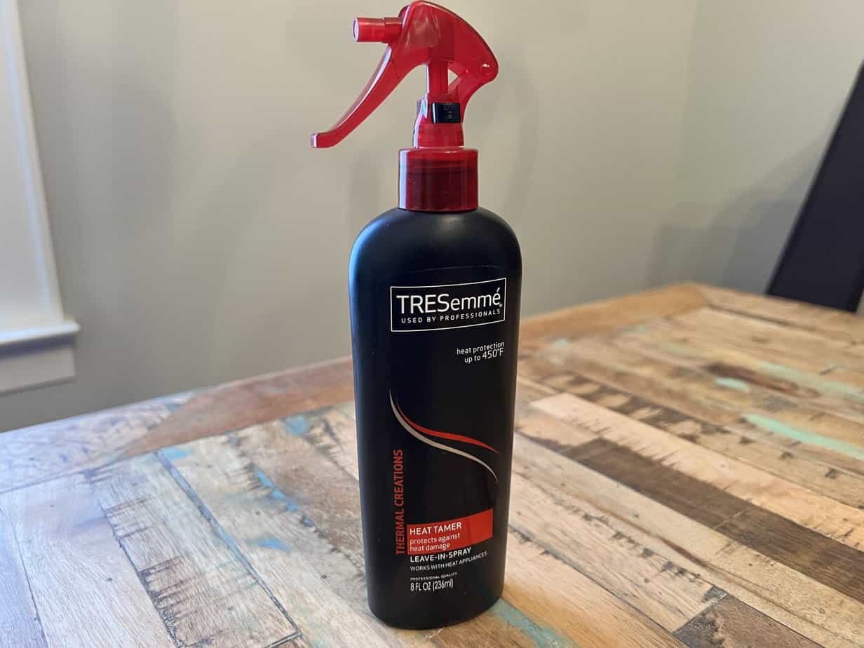 A good heat protectant, like this TRESemmé's leave-in spray, creates a protective barrier against heat appliances.