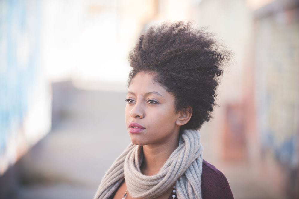 Cute black girl with healthy hair that's considering taking MSM powder for natural hair growth