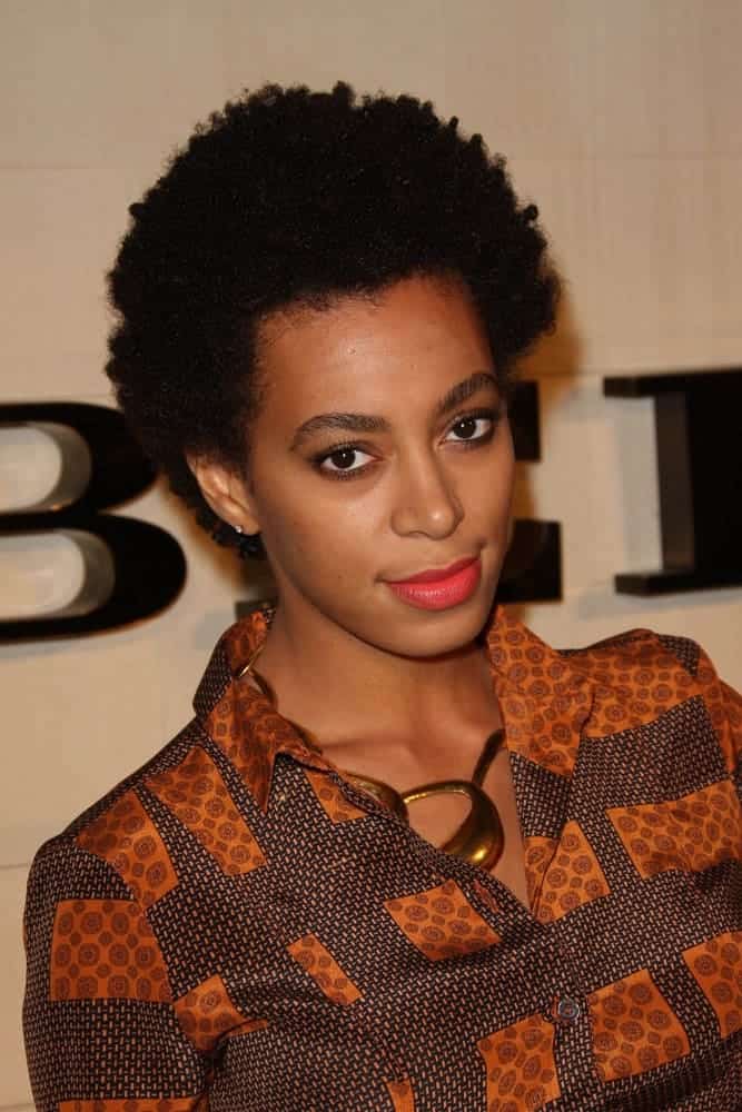 Solange Knowles following a big chop at the Burberry Body Launch, showing off her loose curls in a TWA hairstyle