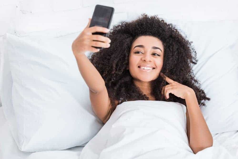 The Curly Girl Method for Curly, Wavy, Straight & Color Treated Hair 7 African American women laying in the bed wondering how to follow the Curly Girl Method