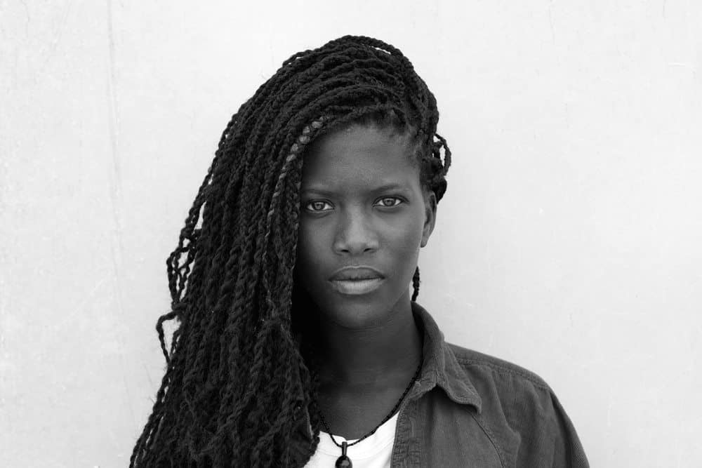 black women with crochet locs in black and white