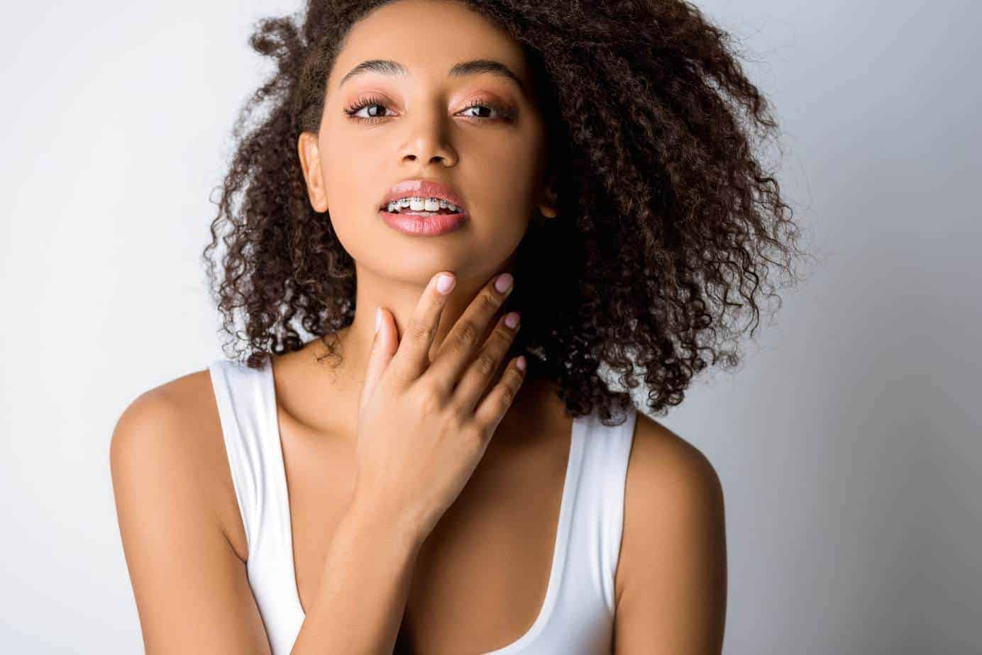 The Best Way to Use Rosemary Oil for Hair Growth 6 women with curly hair looking in the mirror holding her chin preparing to use a rosemary oil hair growth recipe