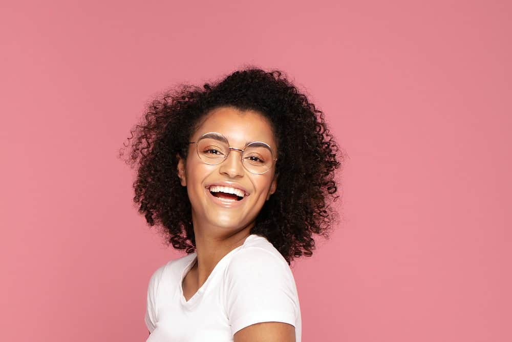 A cute black female that used expired hair products which affected her hair growth.