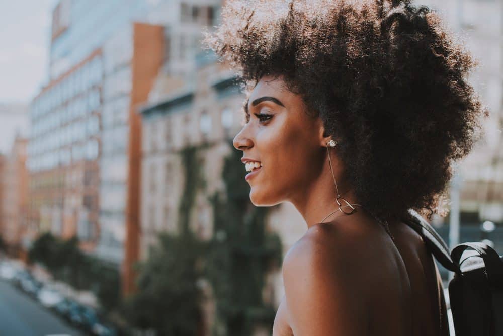 A black girl with sensitive skin and type 4d curly hair wondering about using fresh onion juice for scalp health.