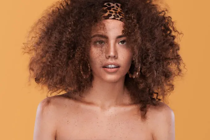 Light-skinned mixed black girl wearing a wash-n-go style created with expired hair products.