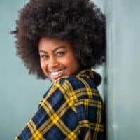 Black lady with kinky curly hair strands