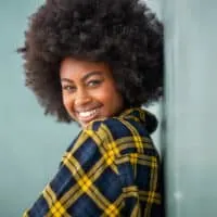 Black lady with kinky curly hair strands