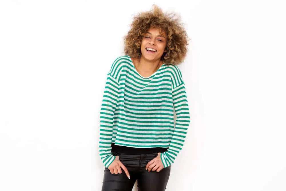 Using Dawn Dishwashing Soap for Hair Growth and Dandruff? Does It Work? 5 Beautiful black female wearing a green and white shirt and black leather pants
