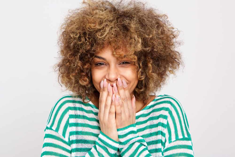 Using Dawn Dishwashing Soap for Hair Growth and Dandruff? Does It Work? 4 Cute female looking into the camera while laughing