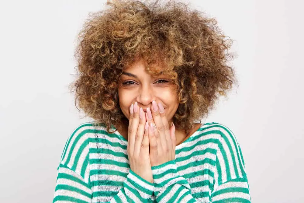 Using Dawn Dishwashing Soap for Hair Growth and Dandruff? Does It Work? 4 Cute female looking into the camera while laughing