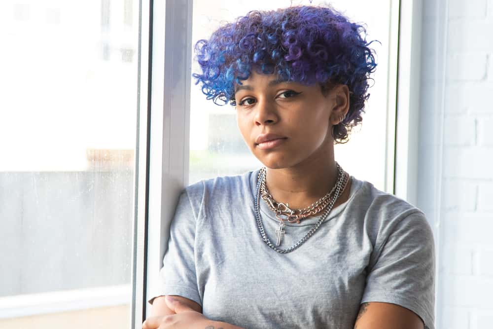 how to dye black hair purple 4 Female wearing rainbow shades, purple-blue hair, earrings, and natural lipstick color.