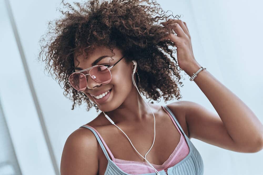 Cute black girl photo after taking advantage of goat milk benefits for hair growth.