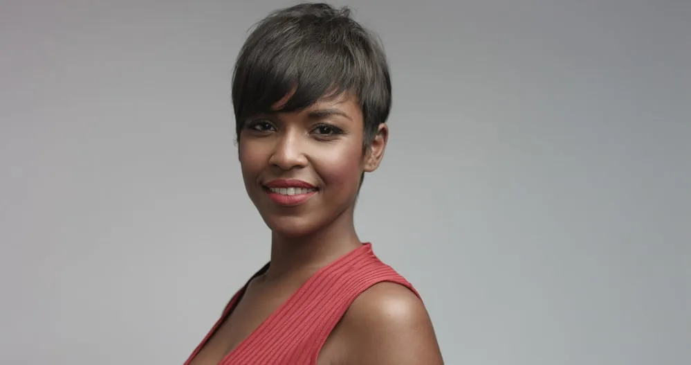 How To Do a Silk Wrap on Natural Hair at Home 4 Black adult female with straight hair wearing make-up and stylish red dress looking into the camera while smiling.