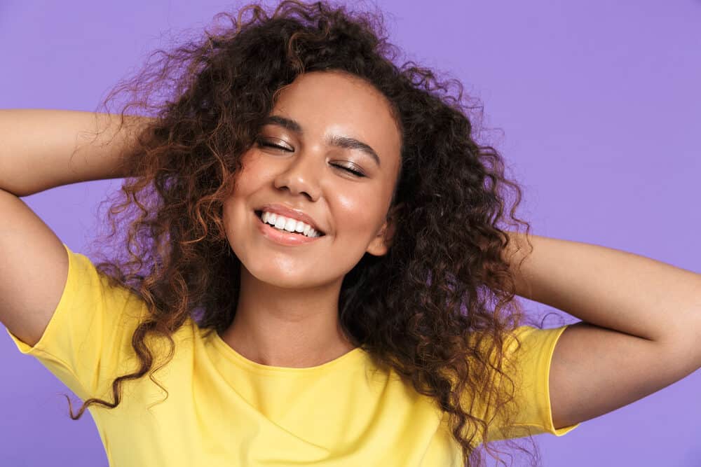 African American women with 3c curly hair strands with warm purple overtones