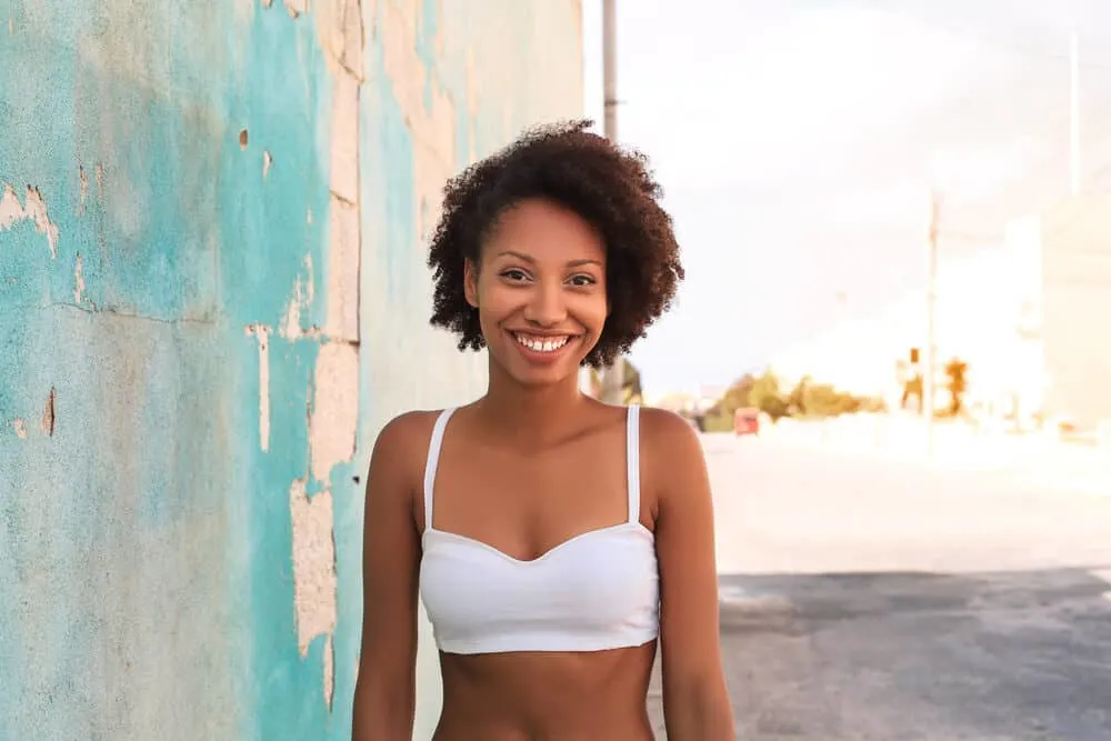 Is Aussie Bad for Your Hair? What About Their Shampoo, Conditioner, and Other Products? 4 Adult female with hair curlier than ever after using Matrix Amplify Volumizing shampoo.