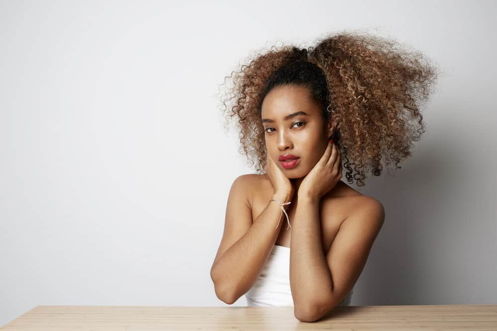 Cute black female with brown ombre bleached hair after dyeing her very dark hair.