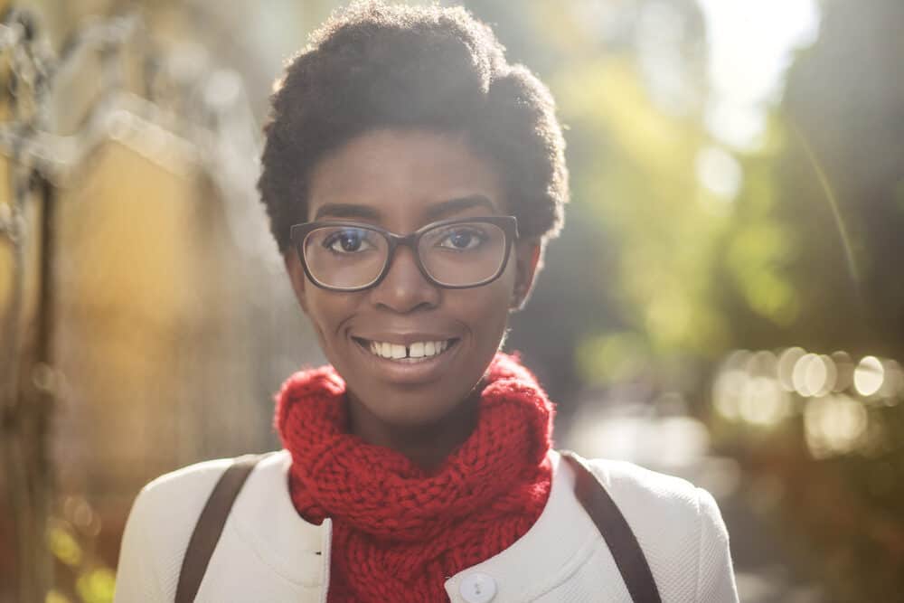 African American female with a 4D hair type wearing her natural hair in a teeny weeny afro.