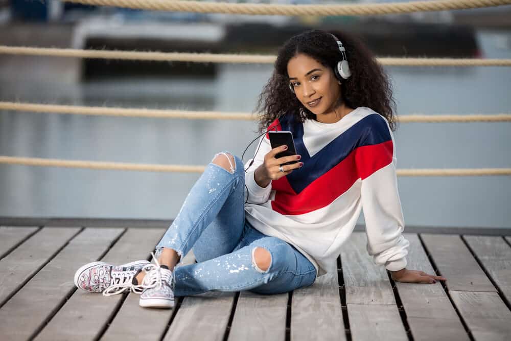 Light-skinned girl with African American hair blended with kinky straight hair weave.