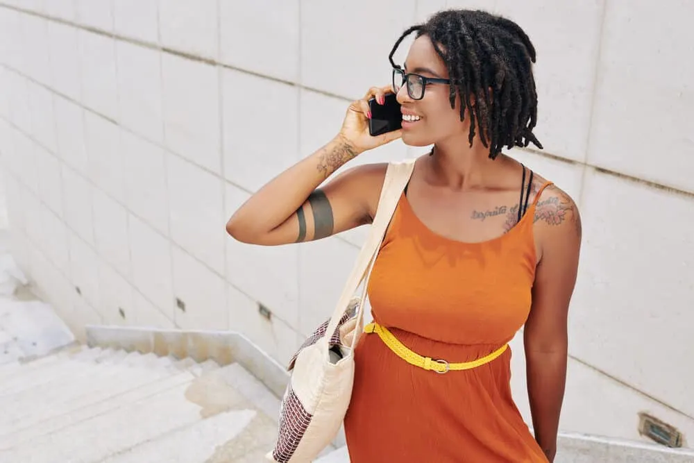 Dread Detox: How to Deep Cleanse Dreads with an ACV Rinse 3 A beautiful African American female with clean locs after an ACV dread detox.