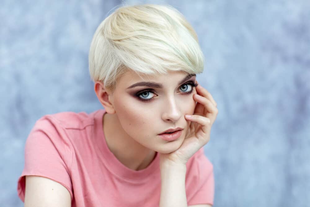 Pretty white girl with a naturally blonde shirt boy cut hairstyle.