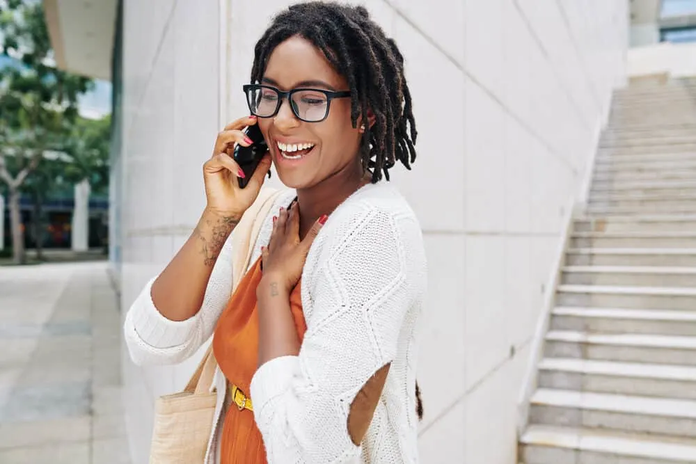Dread Detox: How to Deep Cleanse Dreads with an ACV Rinse 4 A pretty black lady used a thorough dread detox and natural oils to promote hair growth.