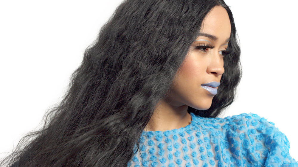 How To Do Quick Weave Hairstyles: Step-by-Step DIY Guide 8 Pretty African American women with a blue dress, blue lipstick, and human hair extensions.