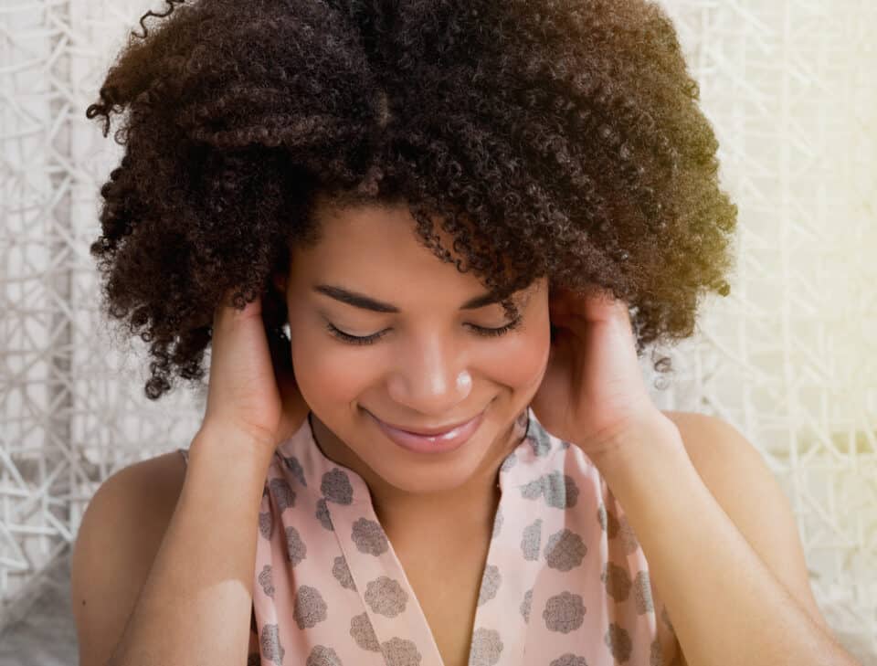 Why Do Women Play With Their Hair? 7 Body Language Cues