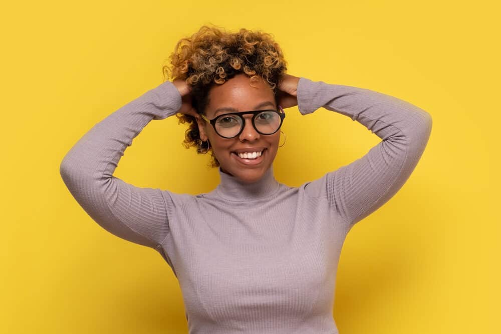 African American women with light yellow tones in curly hair after using box dye