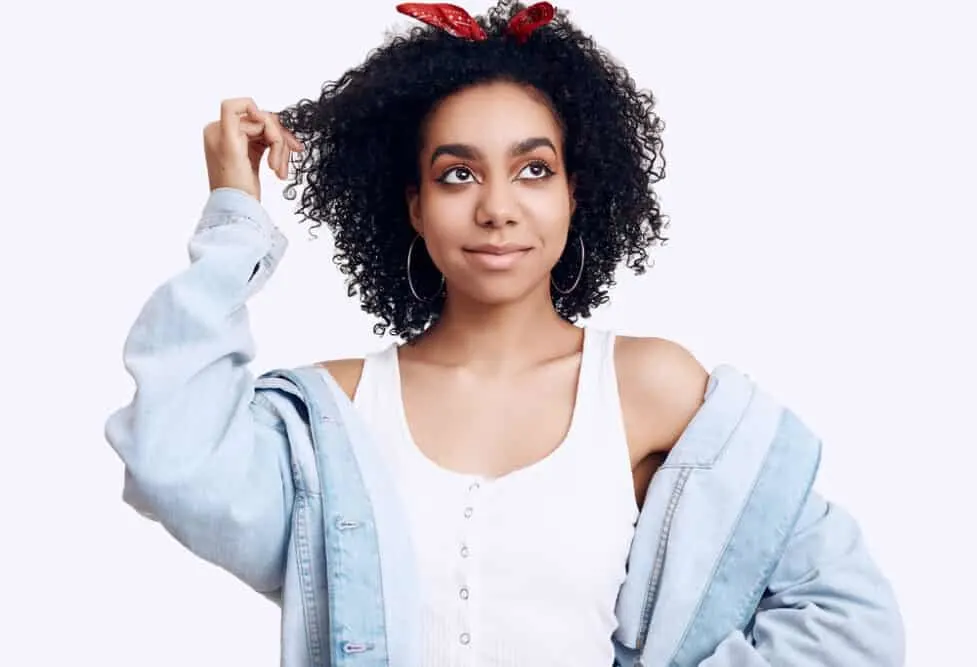 Are Hair Extensions Bad for Your Hair? How To Mitigate Damage 6 Black women with curly micro rings with a seamless blend with her own natural hair.