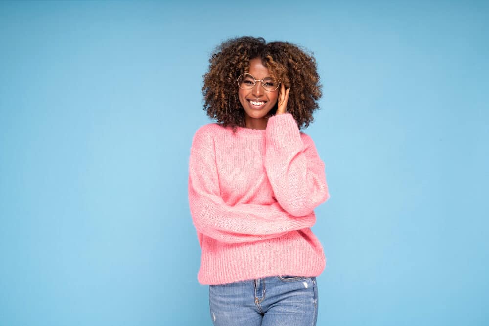 Black girl with curly, shiny, oily hair suitable for a queen