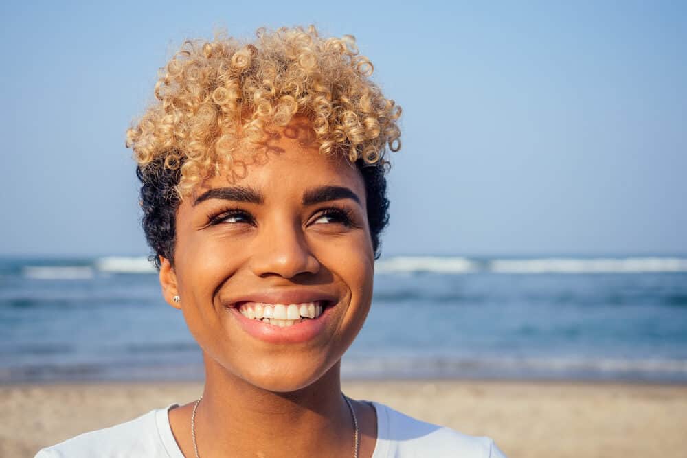 Cute black girl with colored hair that's black underneath and blonde on the outermost layer