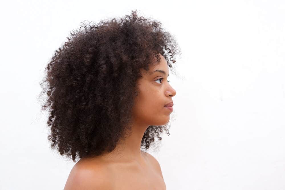 Curly girl with type 4A curl pattern wearing a Rezo Cut from the Devachan Salon.