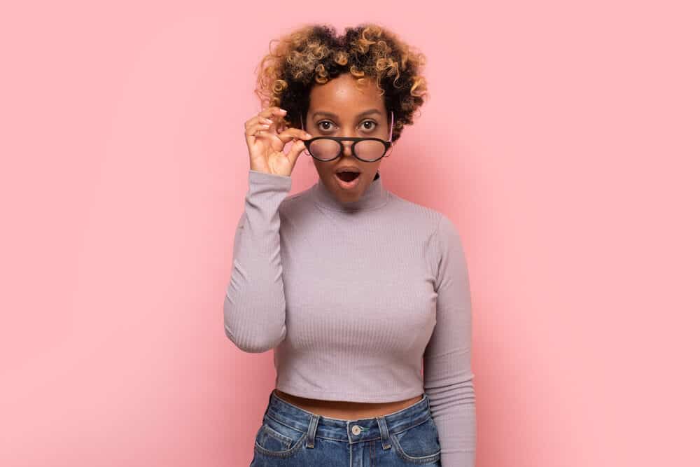 African female with type 4 curls with light blonde undertones