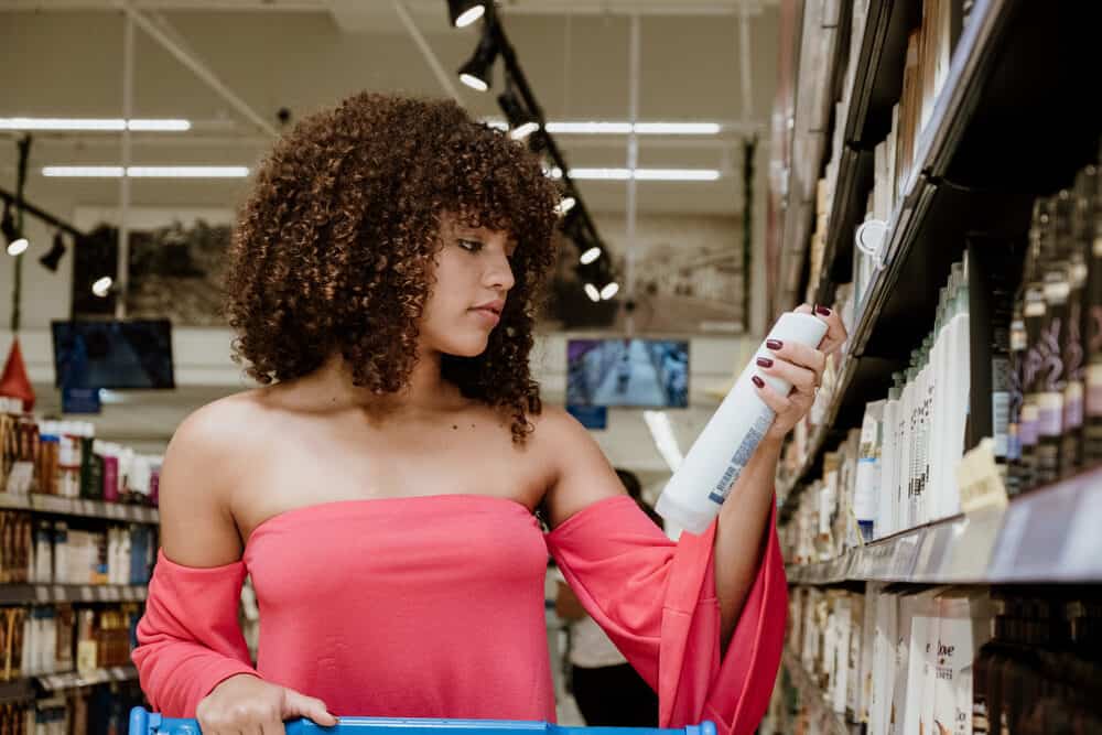 Black woman with curly hair that smells lovely searching for her usual shampoo