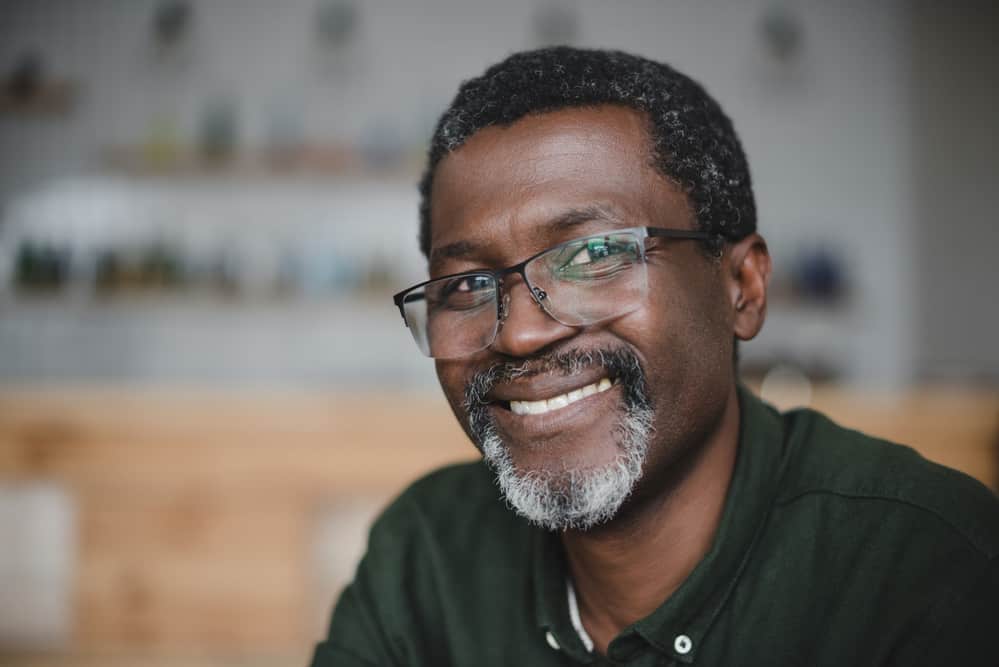 Older black man with short afro hair - the most dominant hair type among African American males.