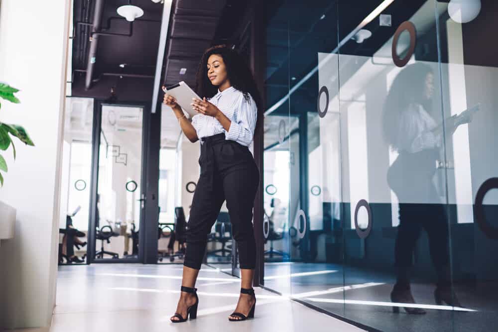 African American business professional with black, curly women's hair strands