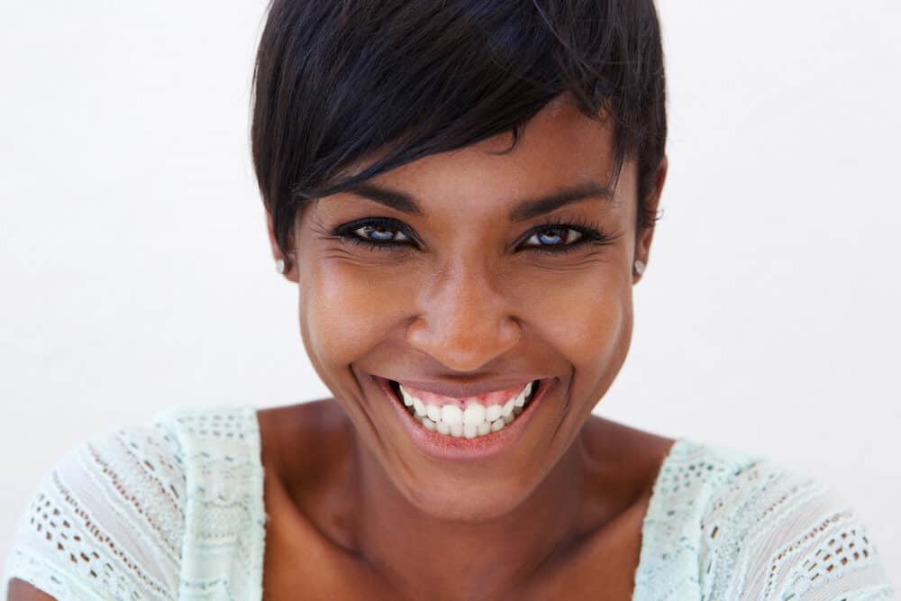 Cute black girl with straight African American hair straightened with a flat iron