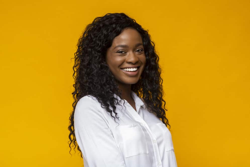 African American lady wearing wavy Indian hair with a white dress shirt