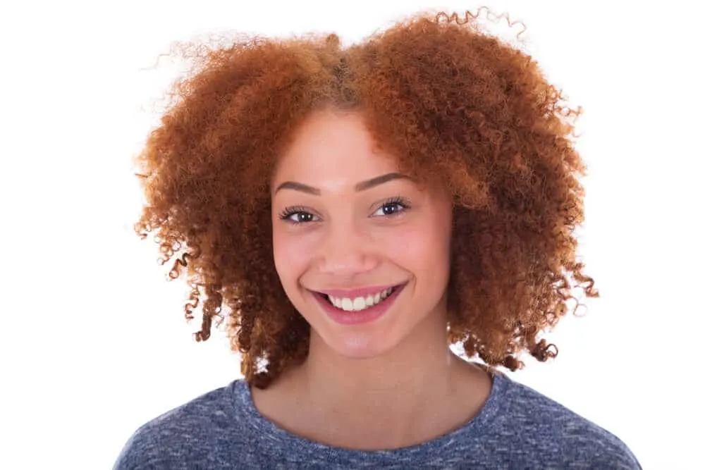 Can Black People Have Red Hair? Common Factors and Misconceptions 1 Young African American lady with pale skin and natural red hair