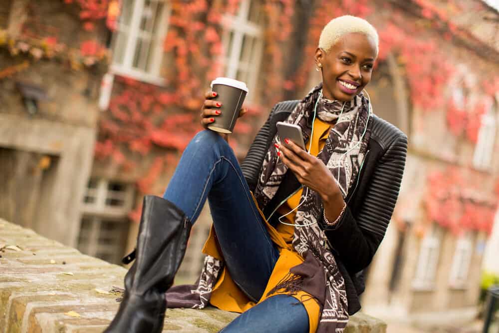 Young African American lady with bright blond hair outside Nova Scotia Agricultural College