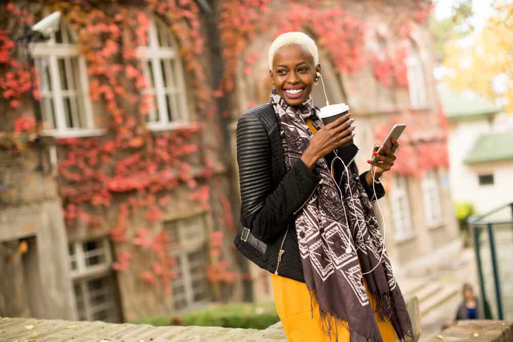 A girl with darker skin pigmentation with a totally distinct blonde TWA