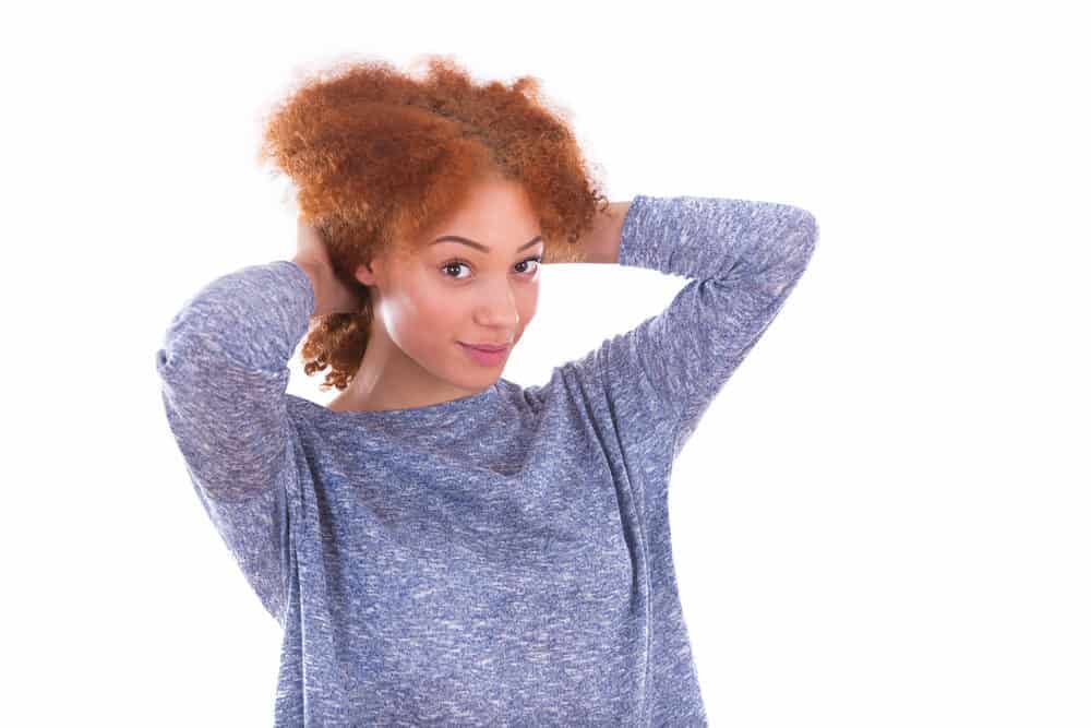 Northern Europe African American woman with frizzy ginger hair and brown eyes