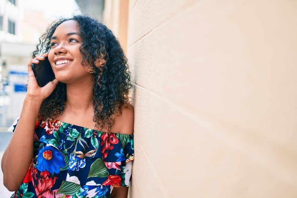 African American female displaying phenotypic quality with wavy scalp hair