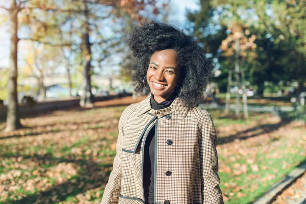 African American lady with curly hair naturally moisturized with olive oil after a co-wash