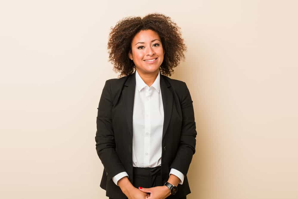 Black lady with naturally curly passion twists posing for a professional photo