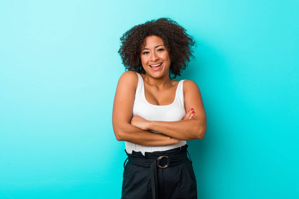 African American female wearing casual clothes and a two-strand twist protective hairstyle