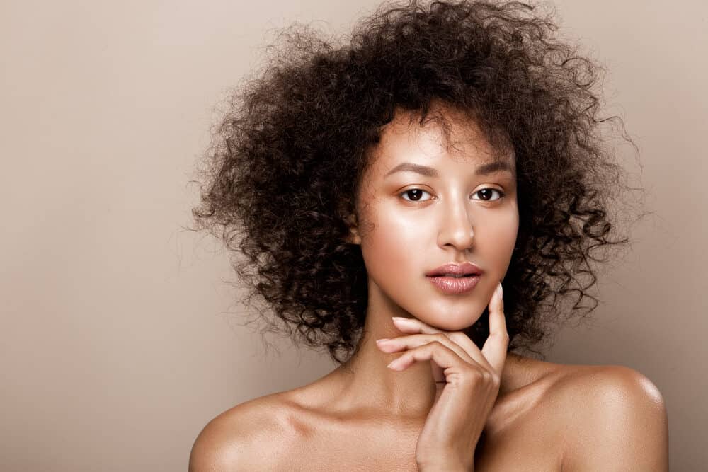 Beautiful African American woman with shoulder-length healthy hair and caramel skin