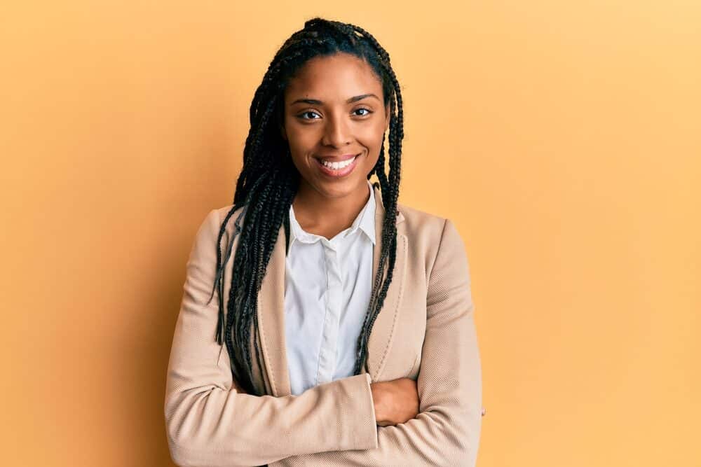 Black girl wearing a natural blend cotton jacket with a white dress shirt