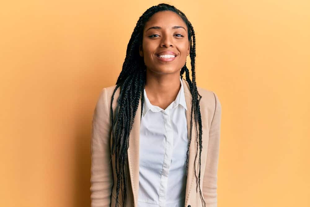 African American female with kinky curls wearing long braids